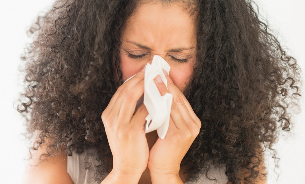 USA, New Jersey, Jersey City, Woman blowing nose