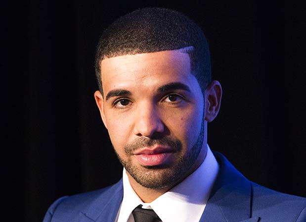 Rapper Drake looks on during an announcement that the Toronto Raptors will host the NBA All-Star game in Toronto, September 30, 2013. Toronto was selected as the host of the National Basketball Association's (NBA) 2016 All-Star Game, marking the first time the showcase event will be held outside of the United States, the league said on Monday. REUTERS/Mark Blinch (CANADA - Tags: SPORT BASKETBALL ENTERTAINMENT) - RTR3FFZO
