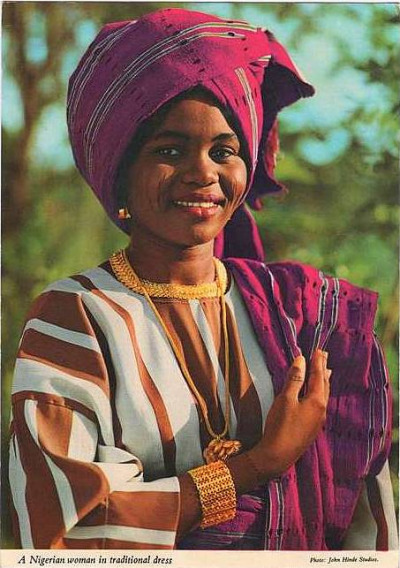 A young lady wearing a complete Aso oke in vibrant colour in the 1980s. Photo-by-John-Hinde