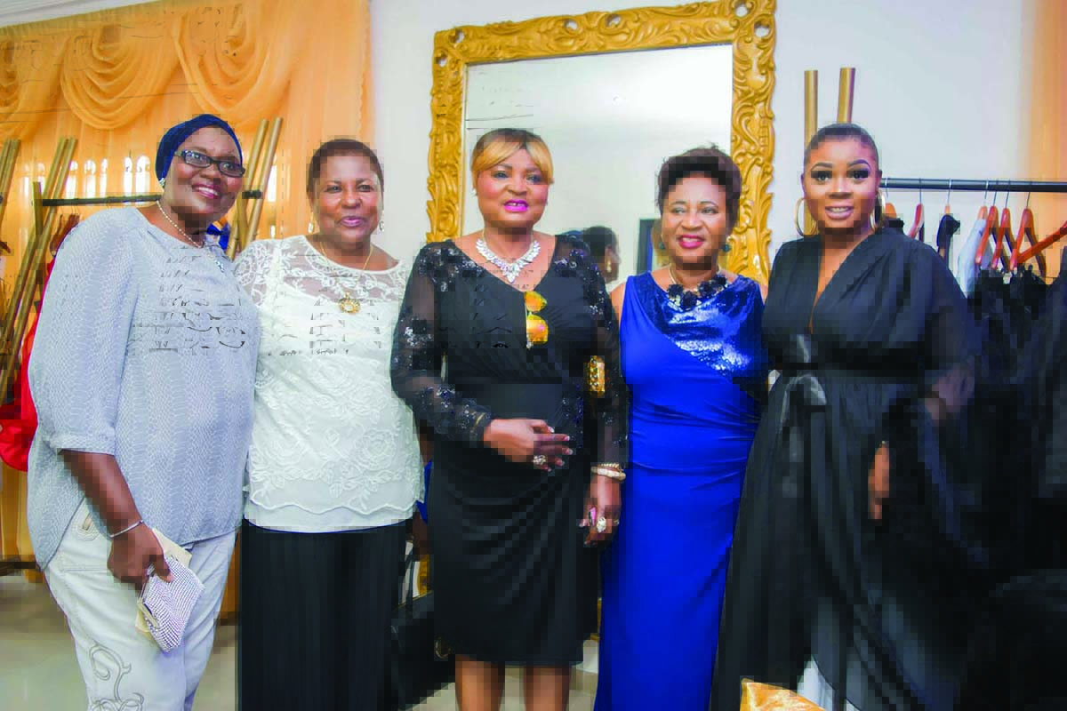 Designer flanked by her mom and friends