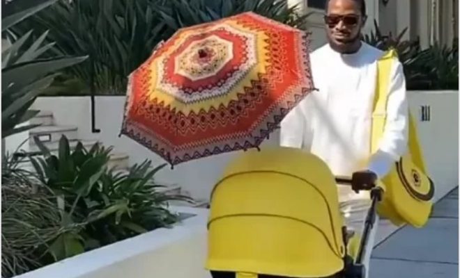 Singer, D’banj steps out with new born son (photos)