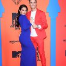 Ronaldo and girlfriend slaying on a red carpet.