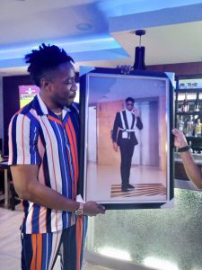 Ike with his portrait. 