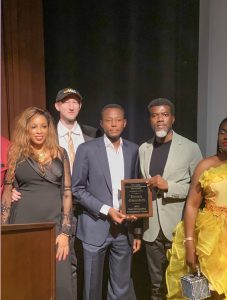 Reno Omokri posses with award. 