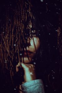 Lady with hands on the chin, thinking